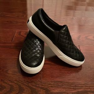 Black leather slip on 1 inch platform shoe from Aldo